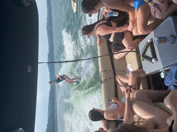 Wakesurfer carving behind the Supreme S240 on Lake Travis - Keep Austin Wet